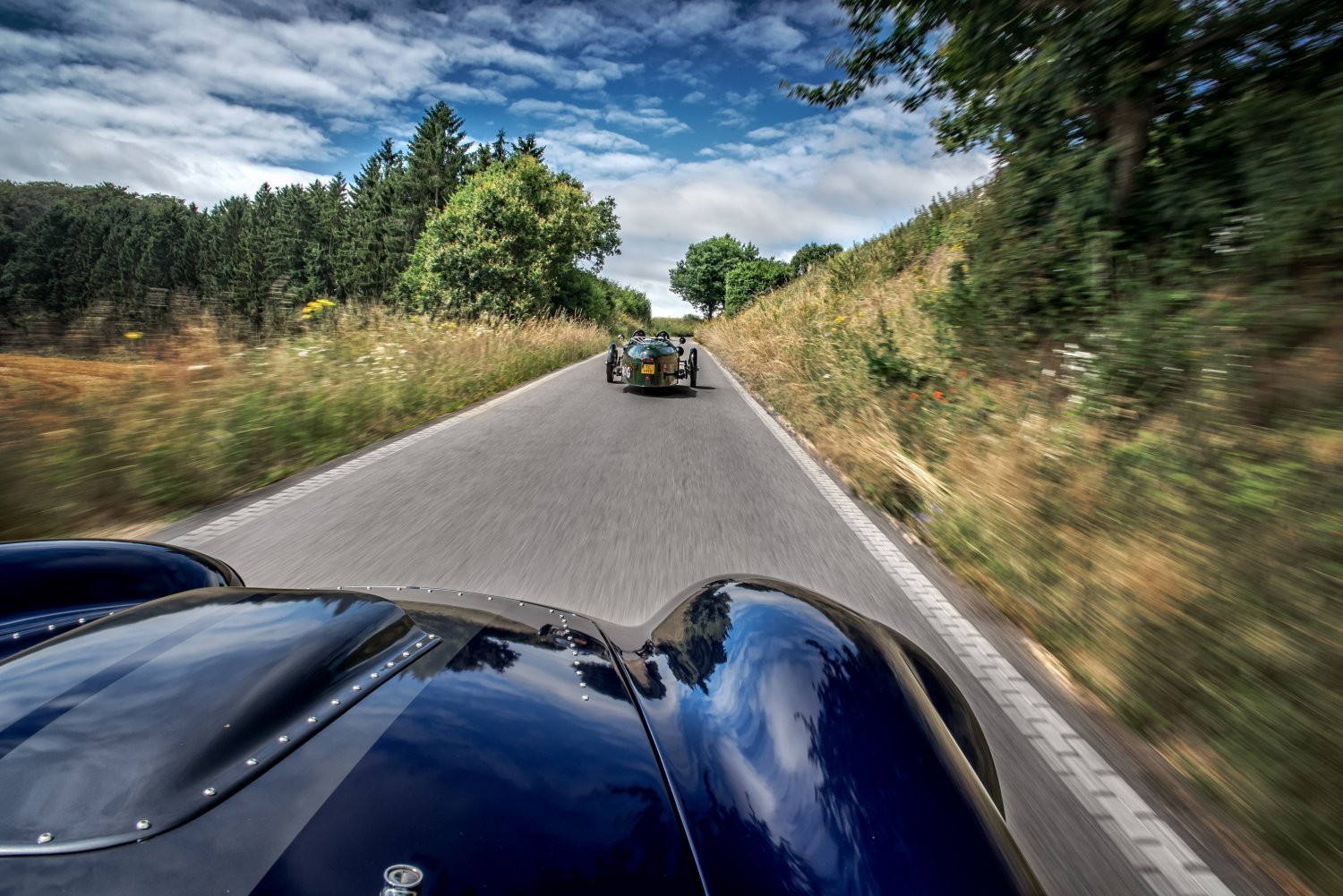 A Cobra chasing a Morgan 3-wheeler